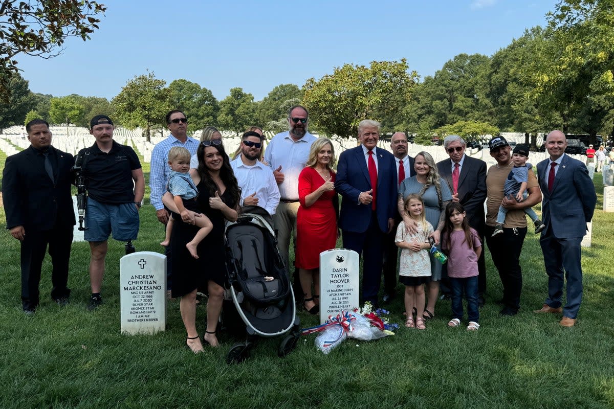 Donald Trump gave the thumbs up at the grave of a soldier at Arlington National Cemetery (Utah Governor Spencer Cox)