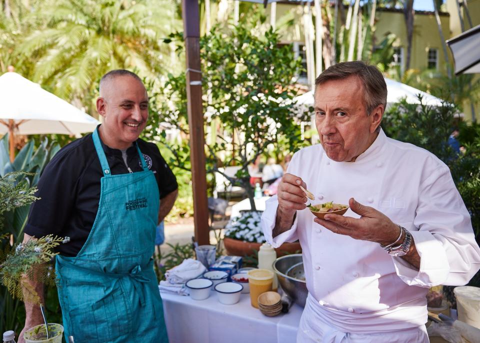 Chef/restaurateur Daniel Boulud savors a dish by chef Jeremy Bearman of Oceano Kitchen during the 2022 Palm Beach Food and Wine Festival brunch at Cafe Boulud Palm Beach. Bearman once worked at Boulud's DB Bistro Moderne in New York.