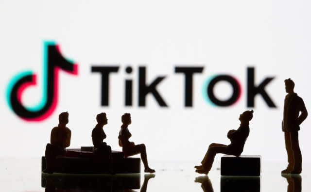 Small toy figures are seen in front of a Tiktok logo in this illustration taken, September 9, 2020. REUTERS/Dado Ruvic/Illustration - RC27VI9QJUCZ