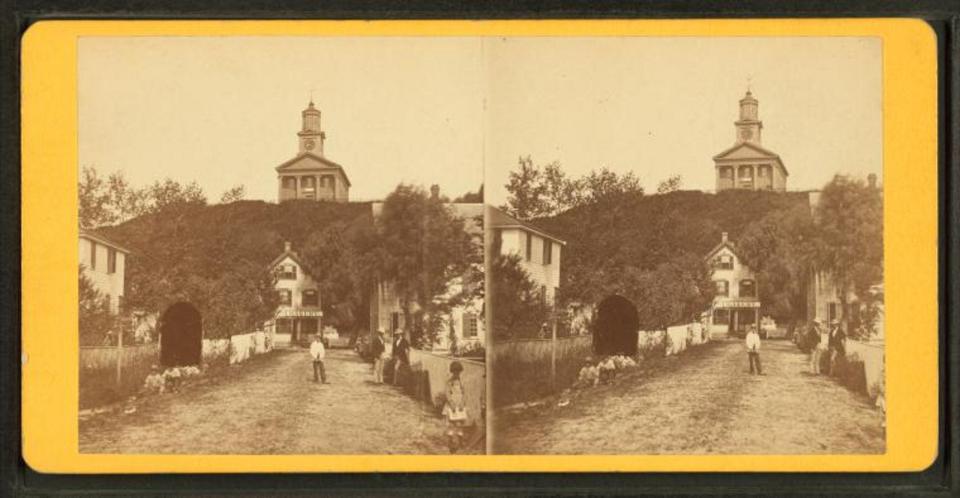 Ryder Street in Provincetown with the town house on High Pole Hill above. Today, the Pilgrim Monument is on the hill.