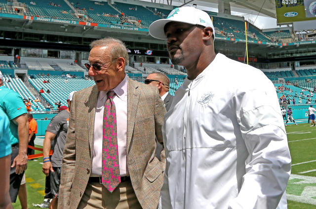 Dolphins owner Stephen Ross, right, and former coach Brian Flores talk during the 2019 season. (David Santiago/Miami Herald/Tribune News Service via Getty Images)