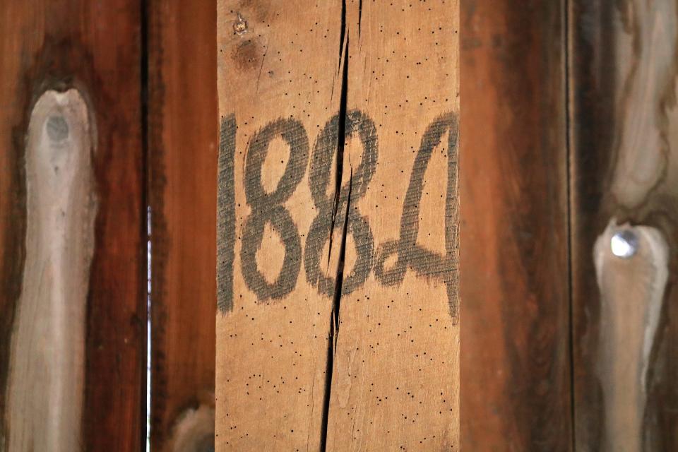 1884 is written on of the posts of Scott Eller's barn in Bath.