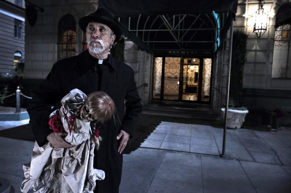 Father Perez (Tony Amendola) has a serious doll problem to deal with in "Annabelle."