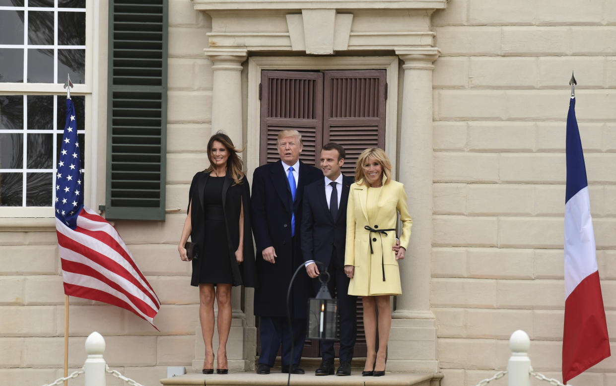First lady Melania Trump, left, President Donald Trump, second from left, French President Emmanuel Macron, second from right, and his wife Brigitte Macron, right, pose for a photo during a visit and private dinner at George Washington’s Mount Vernon estate in Mount Vernon, Va., Monday, April 23, 2018. (AP Photo/Susan Walsh)