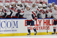 Washington Capitals' Jakub Vrana (13) is congratulated for his goal during the second period of the team's NHL hockey game against the Buffalo Sabres, Friday, Jan. 15, 2021, in Buffalo, N.Y. (AP Photo/Jeffrey T. Barnes)