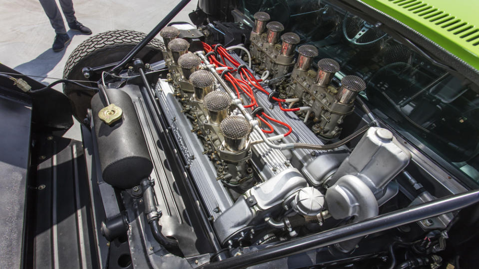 Making about 360 hp, the all-aluminum engine is a 3,929 cc, DOHC V-12 topped by four triple-choke Weber carburetors. - Credit: Bonhams