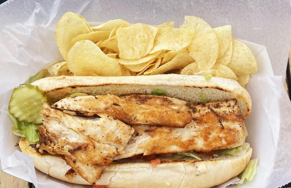 The blackened mahi Po Boy at Little Jim Bait & Tackle featured a toasted hoagie roll smeared wall-to-wall with tangy remoulade sauce and packed with fish.