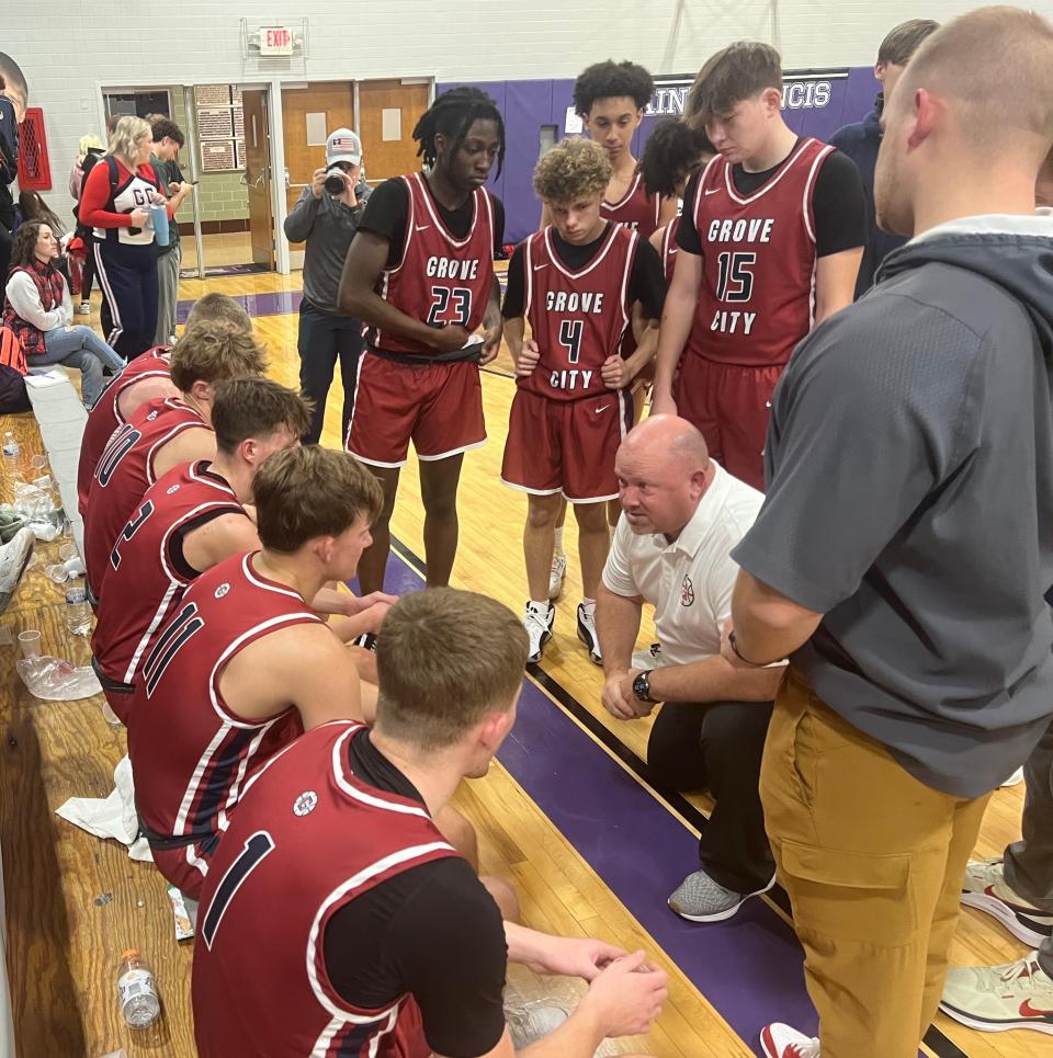 Grove City coach Eric Saxton talks to his team during a 62-51 win at DeSales on Dec. 12. The Greyhounds have won eight consecutive games heading into their OCC-Ohio contest Friday at Pickerington North.