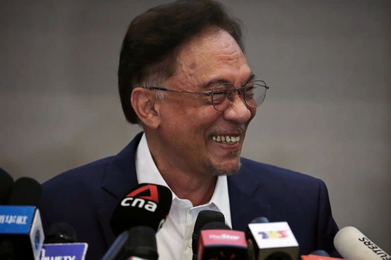 Malaysia opposition leader Anwar Ibrahim reacts during a news conference in Kuala Lumpur