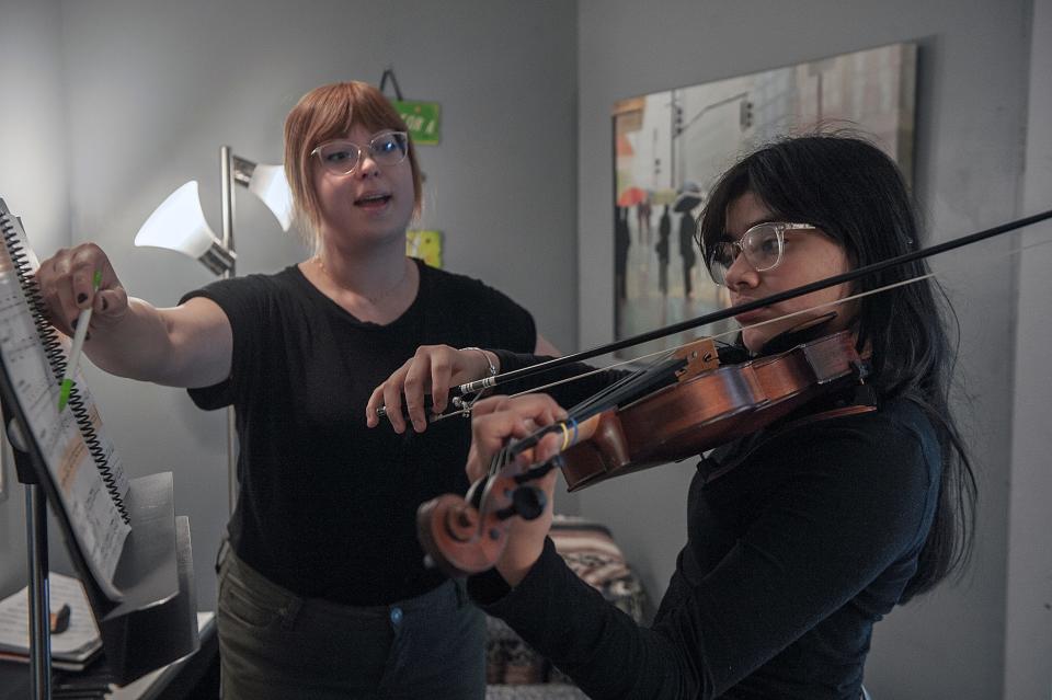 Ashley Morales, 14, practices the violin while under the watchful eye of her instructor, Anna Hornal, at Centre House Music in Framingham,Oct. 13, 2023.