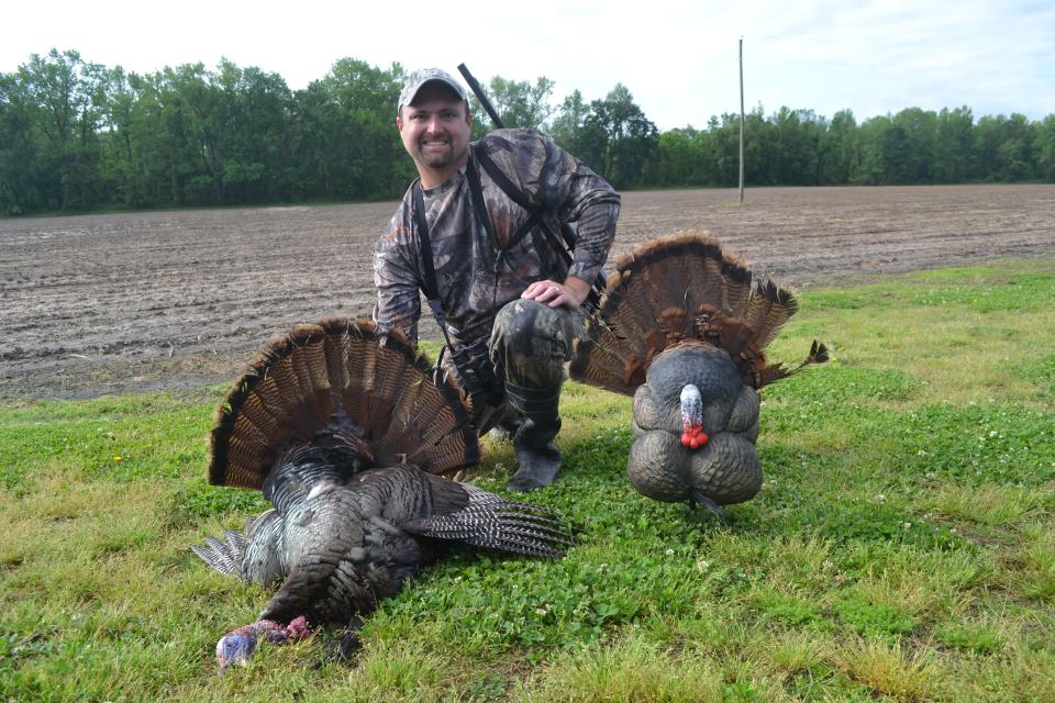The author with a North Carolina gobbler taken with a reaper decoy.
