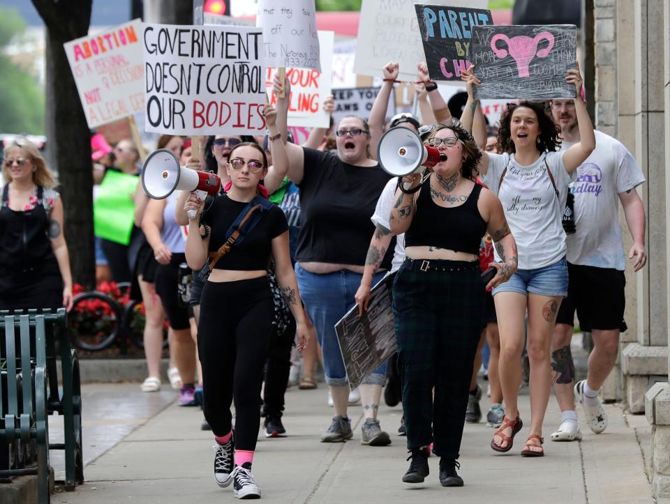 Audrey Umnus, right, leads a march along College Avenue to protest the overturning of Roe v. Wade on July 4, 2022, in downtown Appleton, Wis. Audrey helped organize the event.