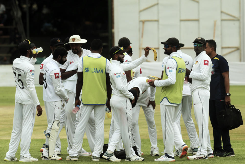Sri Lanka players are seen during a drinks break during the test match against Zimbabwe at Harare Sports Club, Monday, Jan,20, 2020.Zimbabwe is playing in its first international match since the International Cricket Council lifted the country's ban last year(AP Photo/Tsvangirayi Mukwazhi)