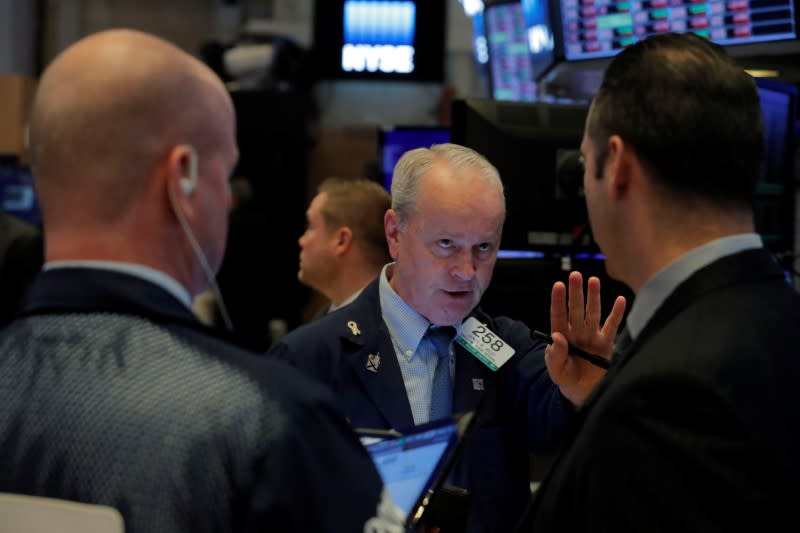 Traders work on the floor of the New York Stock Exchange (NYSE) in New York