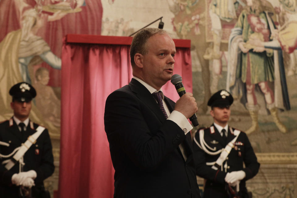 Director go the Uffizi Gallery Eike Schmidt delivers his speech during the unveiling ceremony of the "Vase of Flowers" painting by Jan van Huysum, at the Pitti Palace, part of the Uffizi Galleries, in Florence, Italy, Friday, July 19, 2019. Germany returned the Dutch still-life after it was stolen by Nazi troops during WWII. (AP Photo/Gregorio Borgia)