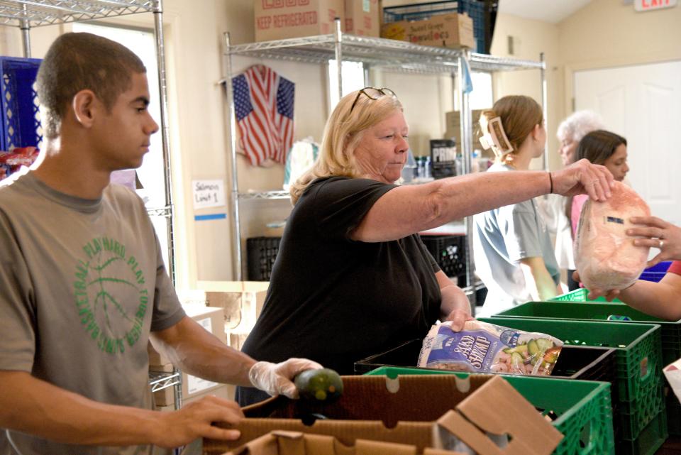 Volunteers serve patrons of the Bradley Food Pantry on Thursday, May 2, 2024, at St. James Episcopal Church in Bradley Beach, New Jersey.