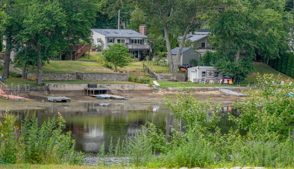 In recent weeks, members of a Facebook group called "Johnson's Pond Strong" have been posting pictures of docks and speedboats sitting on mucky land that was once the pond's bottom.