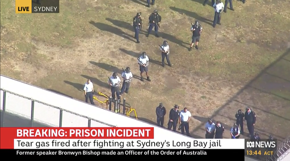 Prisoners and officers are pictured in the yard of Sydney's Long Bay jail.