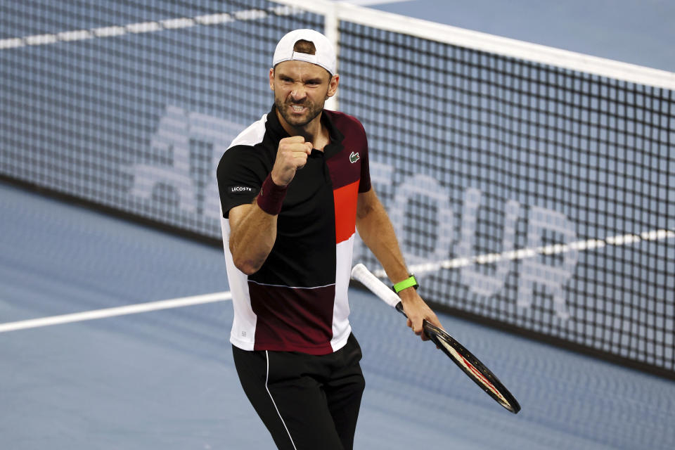 Grigor Dimitrov of Bulgaria reacts after winning the first set in his final match against Holger Rune of Denmark during the Brisbane International tennis tournament in Brisbane, Australia, Sunday, Jan. 7, 2024. (AP Photo/Tertius Pickard)