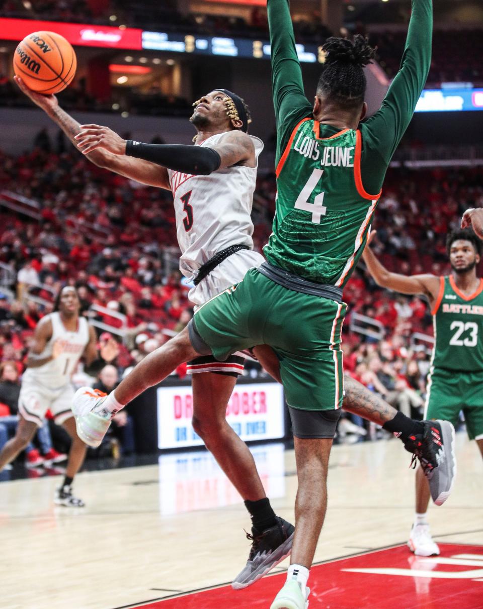 Louisville's El Ellis gets two of his 13 points in the win over Florida A&M 61-55 at the YUM! Center in Downtown Louisville Saturday. Dec. 17, 2022 