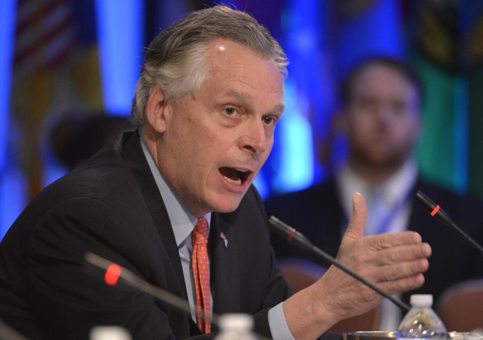 Democratic Governor Terry McAuliffe of Virginia makes remarks during a "Growth and Jobs in America" discussion at the National Governors Association Winter Meeting in Washington, February 23, 2014. The governors will be meeting with administration officials, members of Congress and business leaders as they discuss the nation's economy, education issues, environmental concerns and health and human services. REUTERS/Mike Theiler (UNITED STATES - Tags: POLITICS)