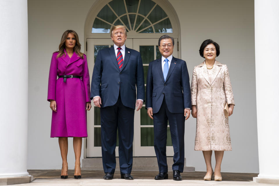 Melania Trump wore a Louis Vuitton magenta coat today to welcome the President of South Korea. [Photo: PA]