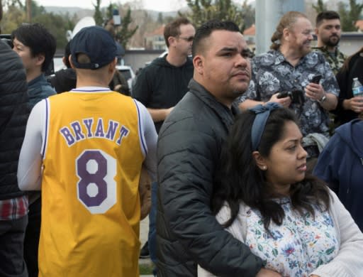 People gather near the scene of a helicopter crash in Calabasas on Sunday that killedLos Angeles Lakers star Kobe Bryant and his daughter Gianna