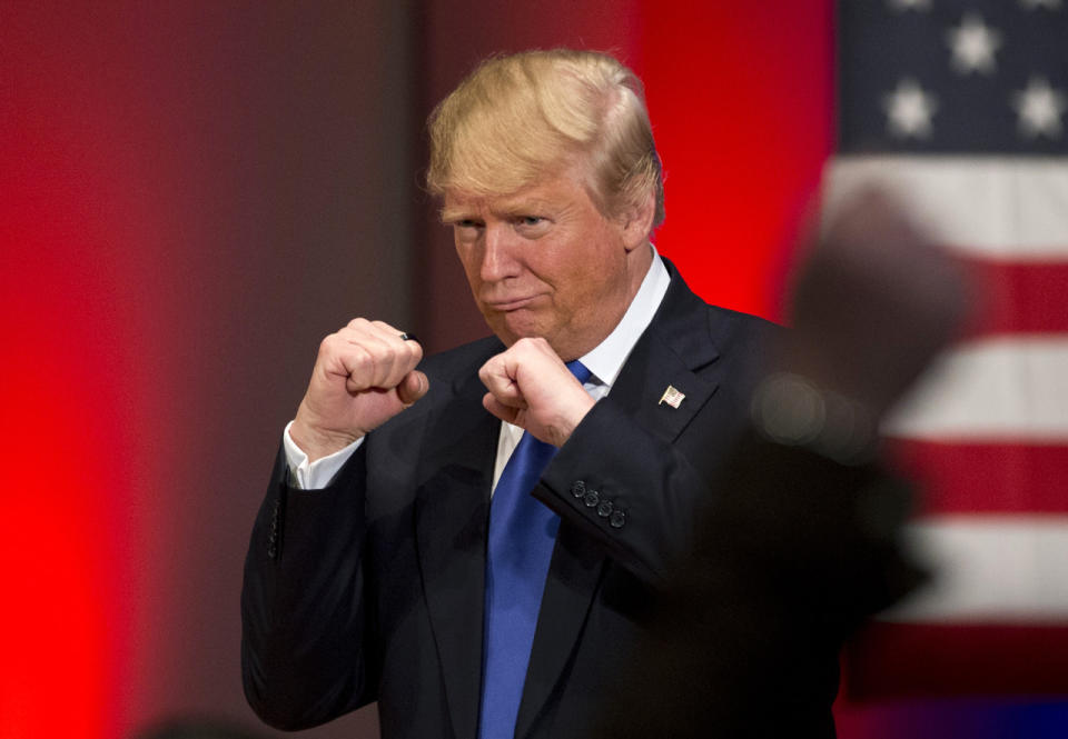 <p>Presumptive Republican presidential candidate Donald Trump poses with a ring given to him by a group of veterans during a campaign event on the campus of Drake University, Jan. 28, 2016, in Des Moines, Iowa. <i>(Photo: Jae C. Hong/AP)</i> </p>