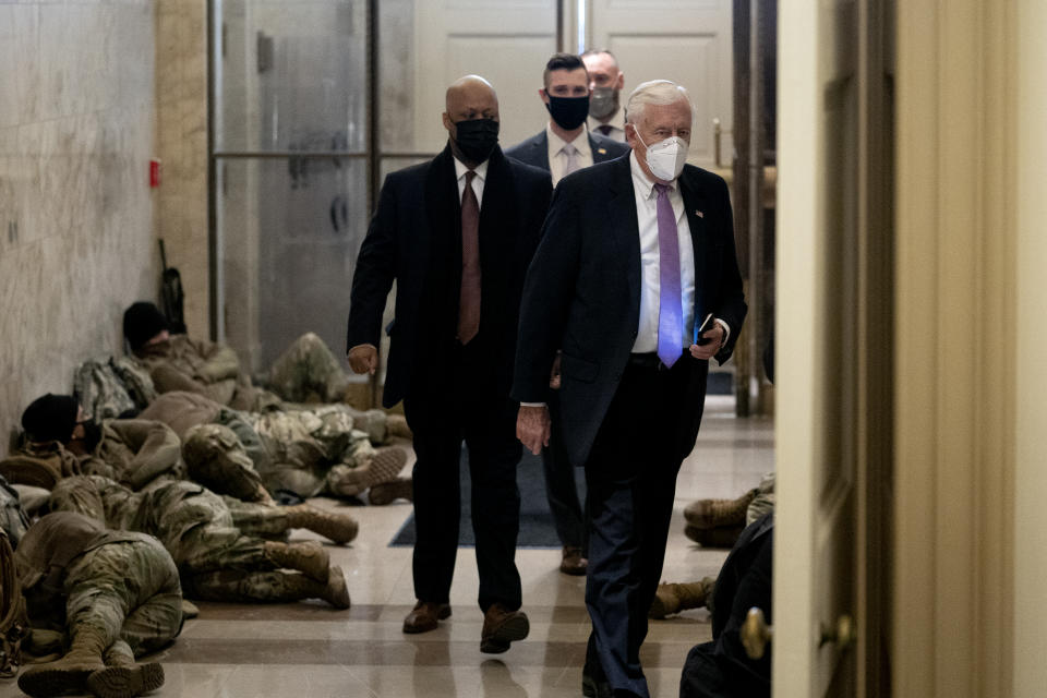 WASHINGTON, DC - JANUARY 13: House Majority Leader Steny Hoyer (D-MD) (R) wears a protective mask while arriving to the U.S. Capitol on January 13, 2021 in Washington, DC. The House of Representatives is expected to vote to impeach President Donald Trump later today, after Vice President Mike Pence declined to use the 25th amendment to remove him from office after protestors breached the U.S. Capitol last week. (Photo by Stefani Reynolds/Getty Images)