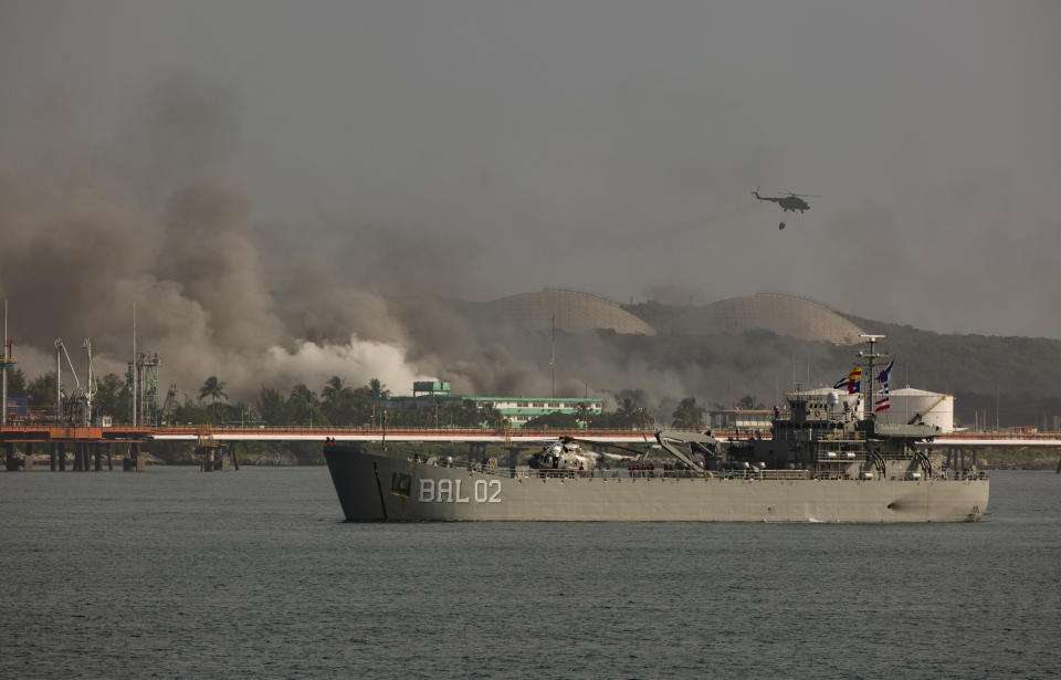 The Mexican military ship Bal 02 arrives to assist with battling a fire at a large oil storage facility in Matanzas, Cuba, Tuesday, Aug. 9, 2022. The fire was triggered by lighting striking one of the facility’s eight tanks late Friday, Aug. 5th. (AP Photo/Ismael Francisco)