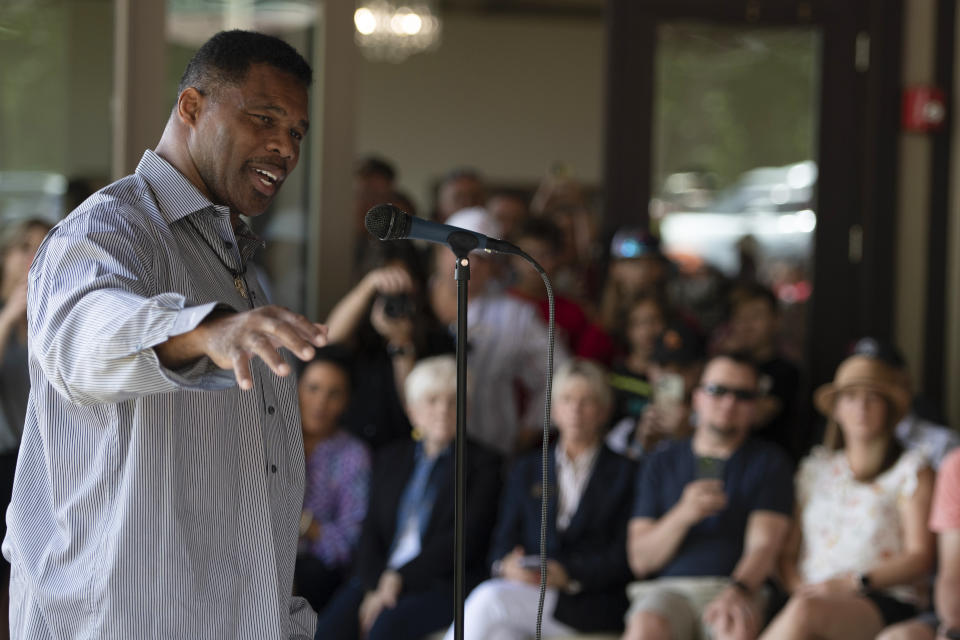 FILE - Republican Senate candidate Herschel Walker speaks to supporters during a campaign stop, May 14, 2022, in Ellijay, Ga. Walker boasts of his charity work helping members of the military who struggle with mental health. The football legend and leading Republican Senate candidate in Georgia says the outreach is done through a program he created, called Patriot Support. But court filings and company documents offer a more complicated picture. (AP Photo/Mike Stewart, Pool, File)