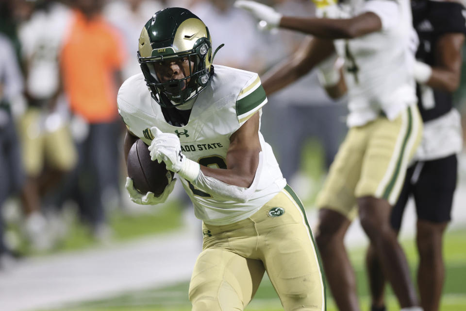 Colorado State running back Justin Marshall (29) runs for a touchdown against Hawaii during the first half of an NCAA college football game Saturday, Nov. 25, 2023, in Honolulu. (AP Photo/Marco Garcia