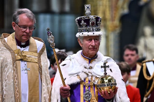 <p> BEN STANSALL/POOL/AFP via Getty Images</p> King Charles leaves Westminster Abbey following his coronation ceremony on May 6, 2023.