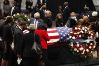 <p>Members of Congress paid their respects by reaching out to touch Lewis's casket. </p>