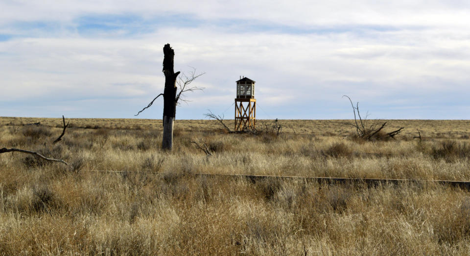 FILE - This Jan. 18, 2015, file photo shows a rebuilt watchtower at Camp Amache, the site of a former World War II-era Japanese-American internment camp in Granada, Colo. A University of Denver team is using a drone to create a 3D reconstruction of the camp in southern Colorado. The Amache effort is part of a growing movement to identify and preserve historical sites connected to people of color in the U.S. (AP Photo/Russell Contreras, File)