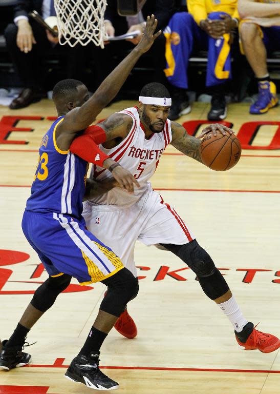 Josh Smith of the Houston Rockets drives baseline on Draymond Green of the Golden State Warriors during Game Three of the Western Conference Finals at Toyota Center on May 23, 2015 in Houston, Texas