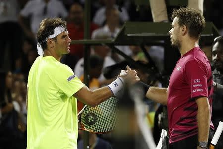 Mar 27, 2017; Miami, FL, USA; Stan Wawrinka of Switzerland (R) shakes hands with Malek Jaziri of Tunisia (L) on day seven of the 2017 Miami Open at Crandon Park Tennis Center. Wawrinka won 6-3, 6-4. Mandatory Credit: Geoff Burke-USA TODAY Sports