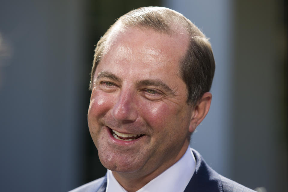 Health and Human Services Secretary Alex Azar smiles during a television interview at the White House, Monday, Oct. 21, 2019, in Washington. (AP Photo/Alex Brandon)