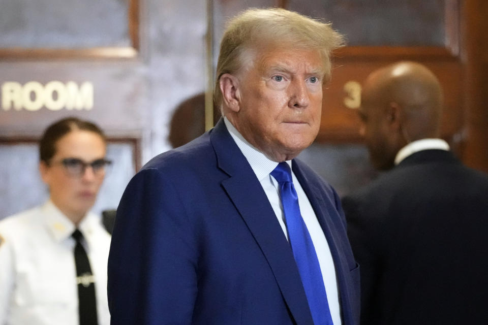 Former President Donald Trump speaks during a break in his civil business fraud trial at New York Supreme Court, Wednesday, Oct. 25, 2023, in New York. The judge in Trump's civil fraud trial has fined the former president $10,000. The judge says Trump violated a limited gag order barring personal attacks on court staffers. (AP Photo/Seth Wenig)