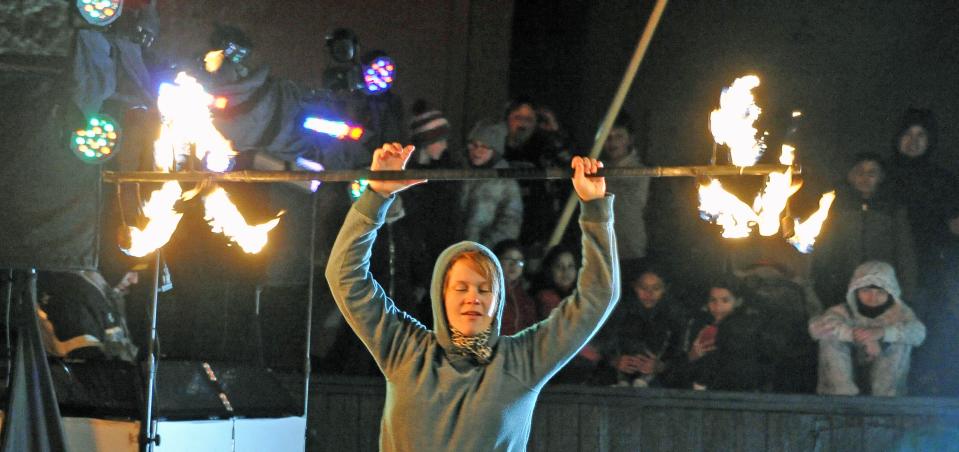 A fire baton twirler awed the crowd during the fire and ice demonstration when Santa came to Orrville Friday night,