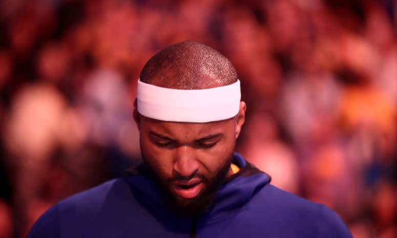 A closeup of DeMarcus Cousins during the National Anthem before a game.