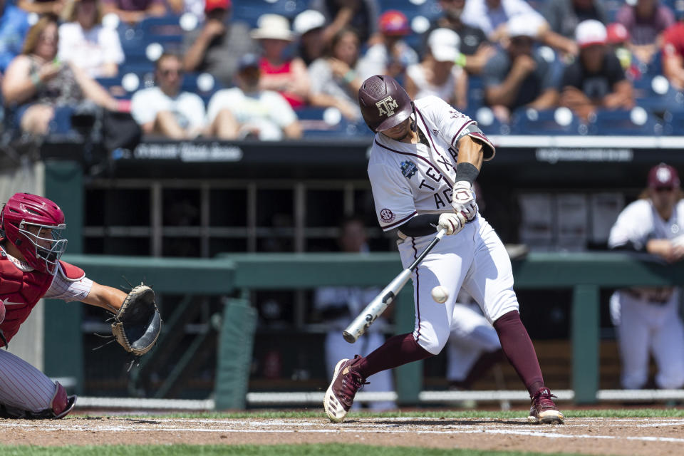 Texas A&M's Jordan Thompson (31) hits a three-run home run in the second inning against Oklahoma during an NCAA College World Series baseball game Friday, June 17, 2022, in Omaha, Neb. (AP Photo/John Peterson)