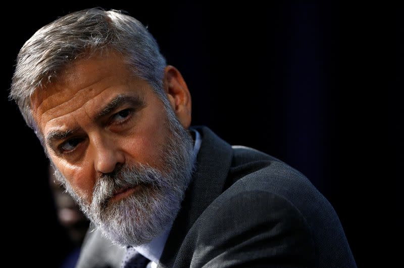 George Clooney attends a news conference during an event about corruption in Africa, in London