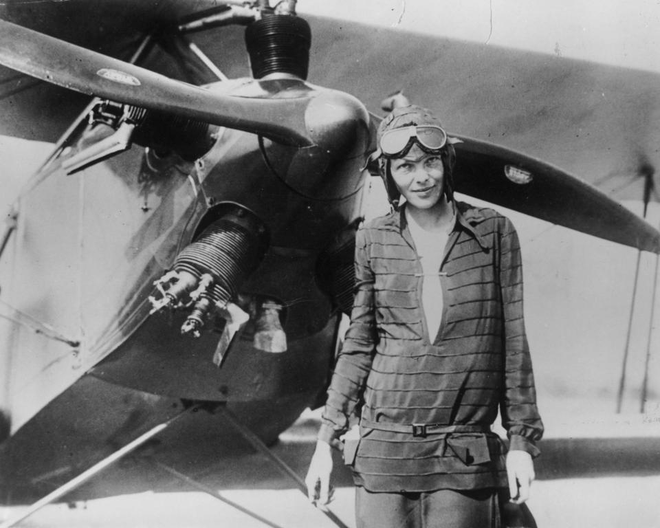 A June 1928 photo of Amelia Earhart in front of the bi-plane called 'Friendship' in Newfoundland.