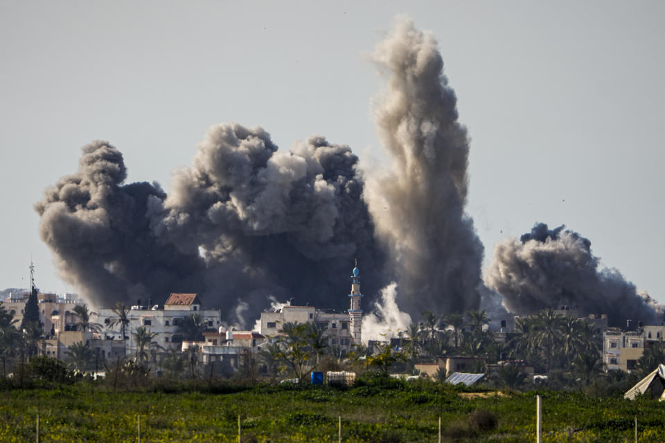 FILE - Smoke and explosion following an Israeli bombardment inside the Gaza Strip, as seen from southern Israel, on Feb. 11, 2024. The latest proposal for a cease-fire in Gaza has the support of the United States and most of the international community, but Hamas has not fully embraced it, and neither, it seems, has Israel. (AP Photo/Ariel Schalit, File)