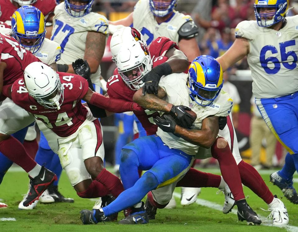 Sep 25, 2022; Glendale, AZ, USA; Los Angeles Rams running back Cam Akers (3) tries to force his way into the end zone against the Arizona Cardinals at State Farm Stadium.