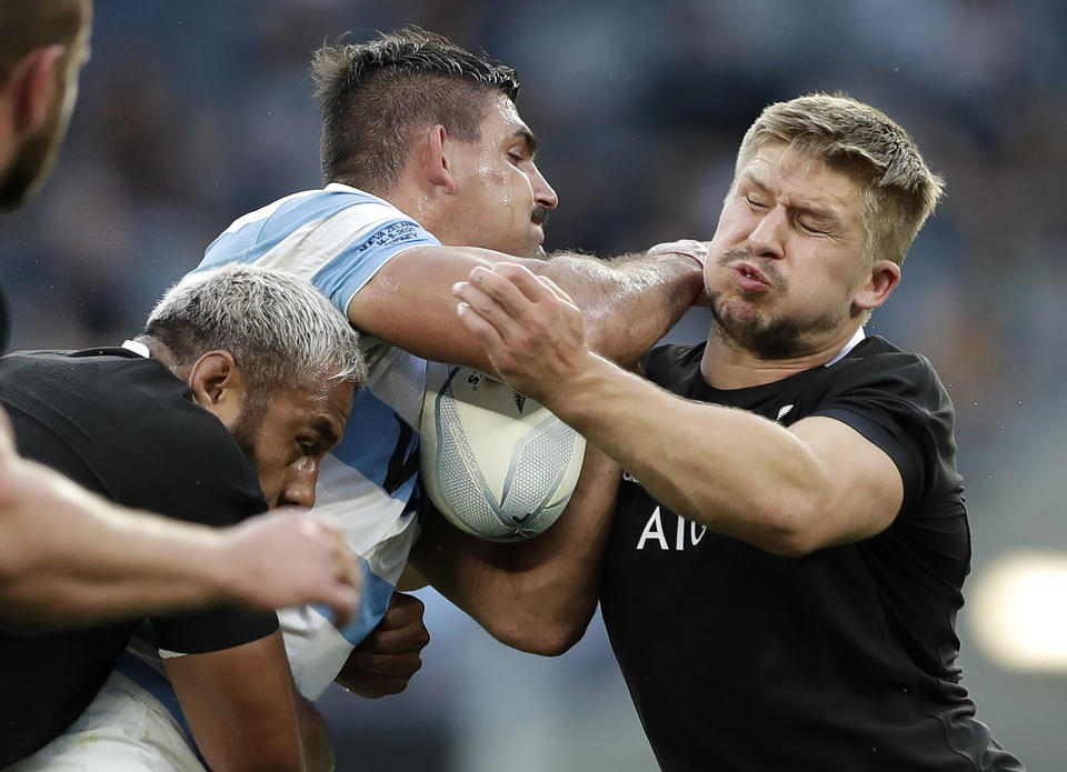 FILE - In this Nov. 14, 2020, file photo, Argentina's Pablo Matera is tackled by New Zealand's Jack Goodhue, right, during the Tri-Nations rugby test between Argentina and New Zealand at Bankwest Stadium in Sydney, Australia. Matera has been stripped of the captaincy of the Argentina national rugby team and suspended along with two teammates over historic social media posts which have been deemed “discriminatory and xenophobic.” (AP Photo/Rick Rycroft, File)