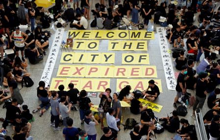 Anti-extradition bill demonstrators attend a protest at the arrival hall of Hong Kong Airport