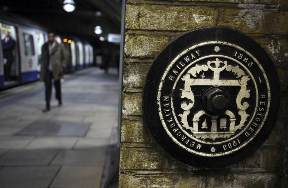 In this photo taken Tuesday, Jan. 8, 2013, a commemorative sign detailing when the station was opened and refurbished, displayed at Baker Street underground station in London. The world's first subway system marked its 150th anniversary Wednesday, Jan. 9, 2013, with reports showing conditions way back when were much as they are today: Busy, congested and stressful for passengers. (AP Photo/Alastair Grant)