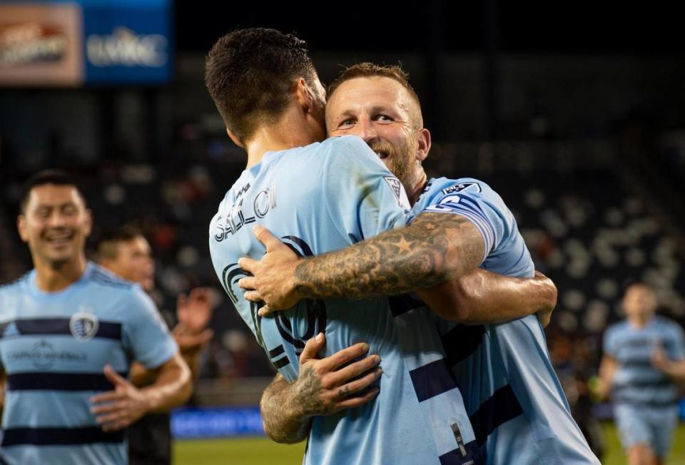 Sporting Kansas City forward Johnny Russell, right, celebrates his second-half go-ahead goal with winger Daniel Salloi during Wednesday night’s Lamar Hunt U.S. Open Cup Round of 16 match against the Houston Dynamo at Children’s Mercy Park in Kansas City, Kan.